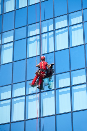 window washer on modern office buildingの写真素材