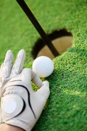  Golf ball on green grass next holeの写真素材