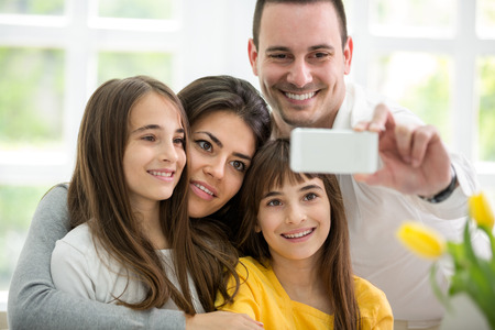 self portrait of happy young family