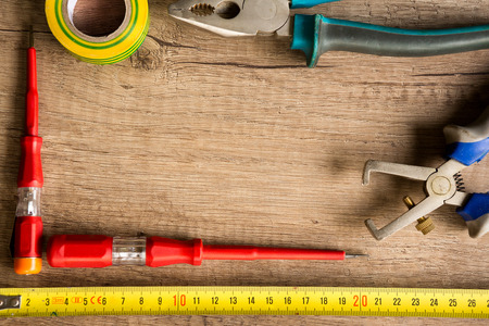 different construction tools  on wooden background