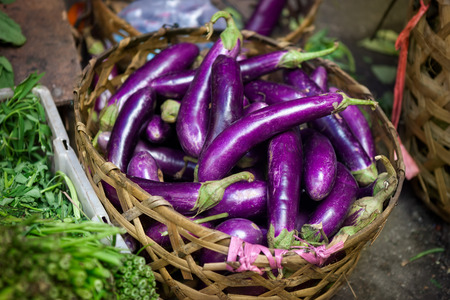 Baskets at a street market full of eggplant at bali