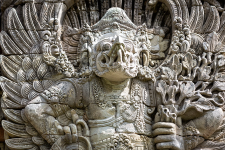 Ancient Balinese statue at the temple in Bali Indonesiaの写真素材