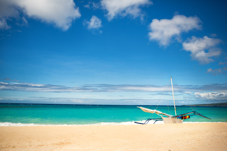 Traditional Philippine boat on coast of azure  seaの写真素材