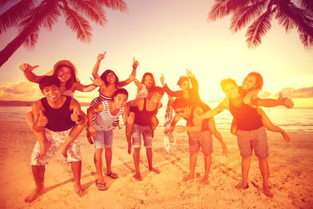 Five couples having fun on beach, summer vacationの写真素材