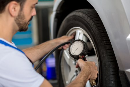 check holding pressure gauge for car tyre pressure measurementの写真素材