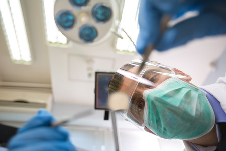Bottom view of dentist working on dental treatmentの写真素材
