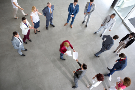 Boss submit report in front of his teamの写真素材