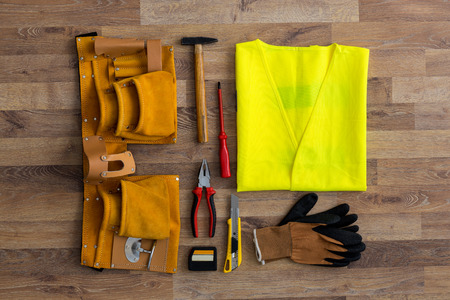 Assorted work tools on wood backgroundの写真素材