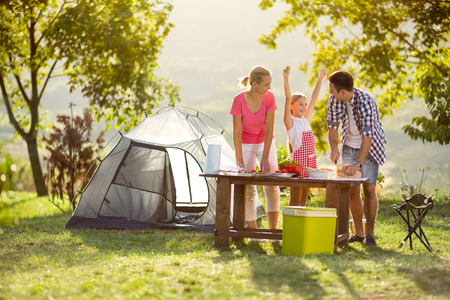 young happy family on vacation in nature