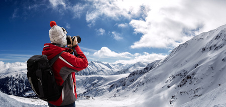 Photographer overlooking winter landscape