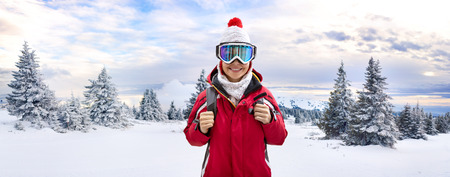 Portrait of smiling woman in ski outfitの写真素材