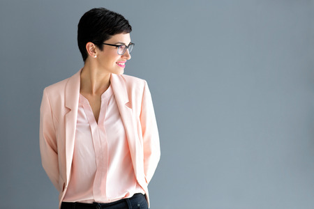 Modern girl with short black hair posingの写真素材