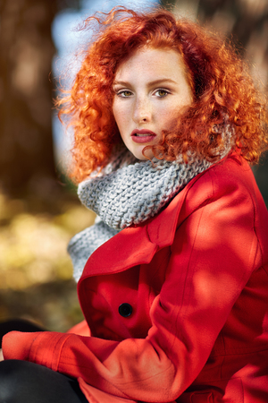 Portrait of young ginger curly girlの写真素材