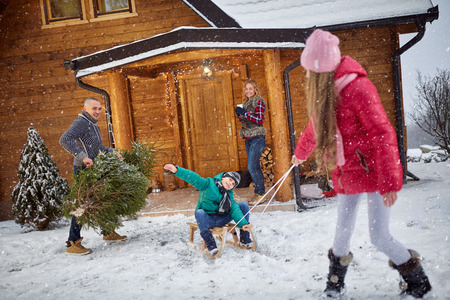 Family enjoying in winter eve- holiday seasonの写真素材