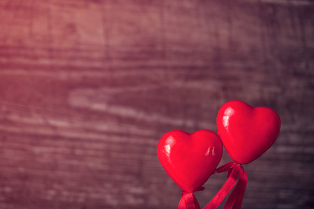 Red heart on the wooden background with copy spaceの写真素材