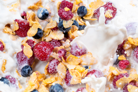 fresh berries and muesli for healthy breakfast background