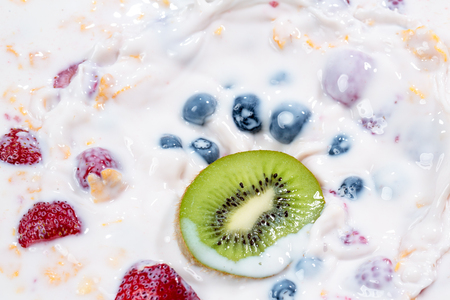 healthy breakfast-muesli and fresh berries and fruits close upの写真素材