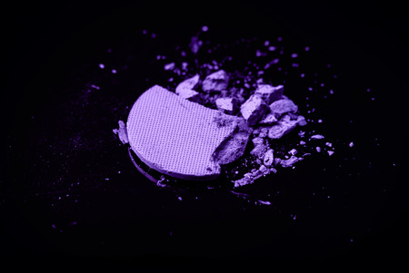 crushed eyeshadow on black backgroundの写真素材