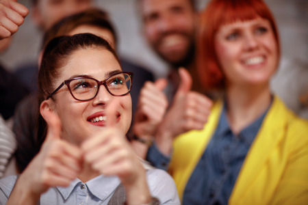 businesswoman team giving thumb up sign of success business teamwork conceptの写真素材