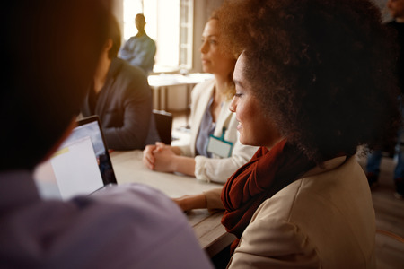 Profile of women in working team working together at laptopの写真素材