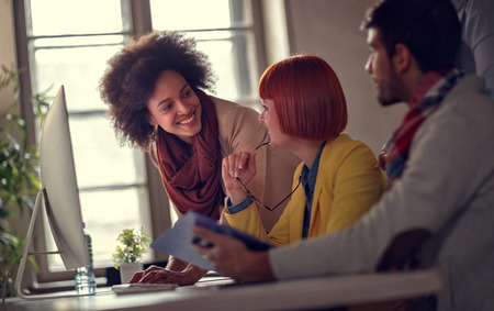 smiling business women working in office