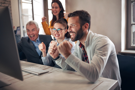 happy business people celebrating successful projects in officeの写真素材