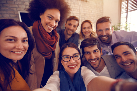 Selfie of urban business team together in officeの写真素材