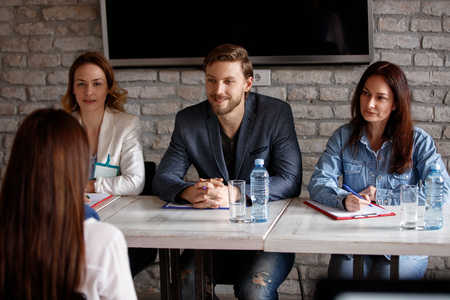 Members of company commission interviewing candidateの写真素材
