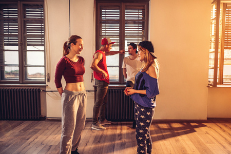 Young modern dancing girls in urban fitness centerの写真素材