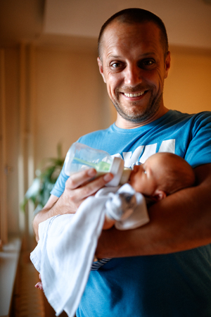 Happy father and son indoorの写真素材