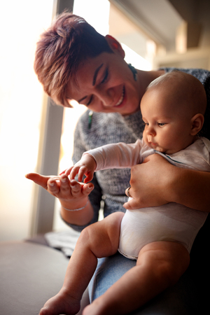 Loving young mom playing with her toddler son. Happy family lifestyle conceptの写真素材