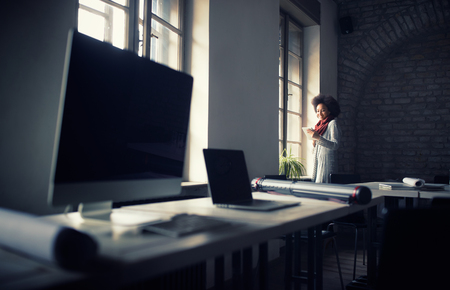 Afro-American woman on break in architect officeの写真素材