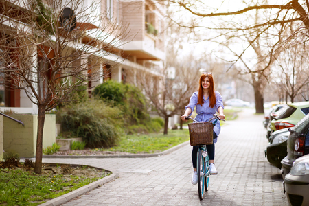 Young female cycling bike in townの写真素材
