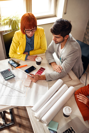 young architect team in office workingの写真素材