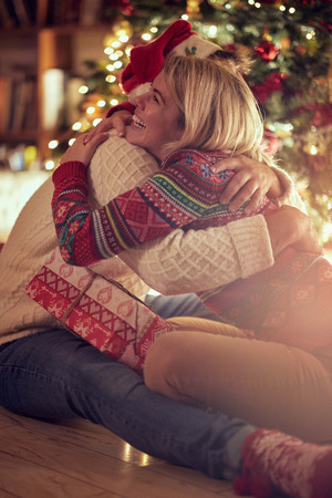 Christmas holiday - romantic happy couple celebrating Christmas togetherの写真素材