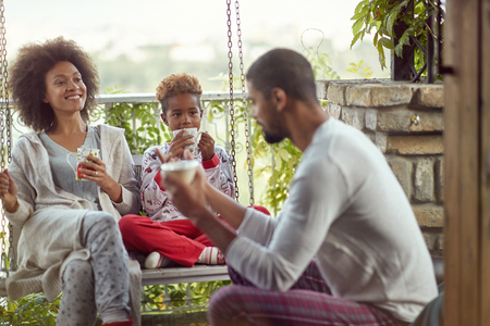 young African American family enjoy in the Christmas morning togetherの写真素材