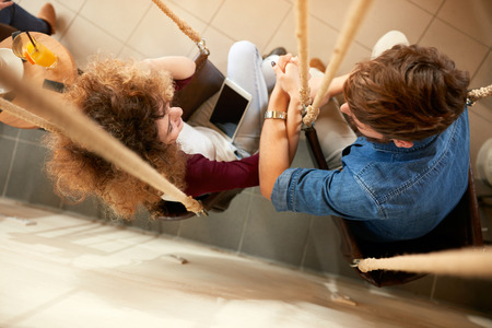 Top view of couple in love in swing indoor