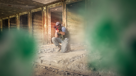 Paintball gamer aiming with target on  cameraの写真素材