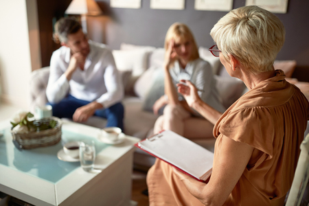 Psychologist giving advice to couple with partnership problemの写真素材