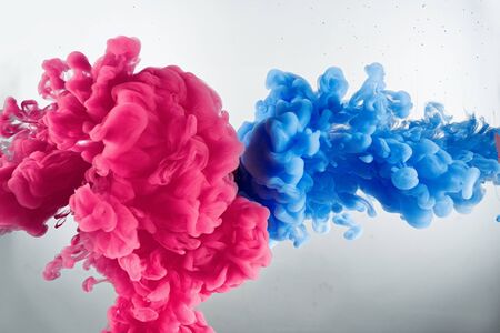 Cloud of colors from ink splash in waterの写真素材
