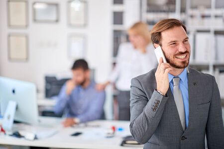 Portrait of successful man worker at officeの写真素材