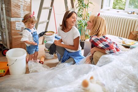 Happy young couple women moving in new houseの写真素材