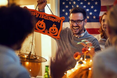 Halloween. spooky man on party for Halloween with scary faces.の写真素材