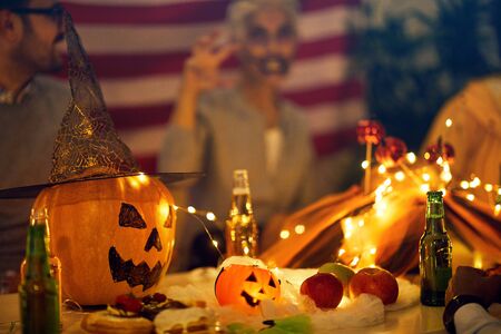 Halloween party  -  pumpkin and String Lights On Tableの写真素材