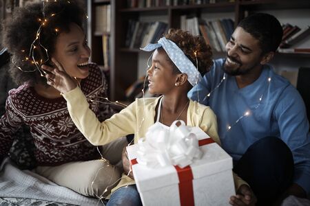 African American Family happy together on Xmas. Smiling People celebrating Christmas.の写真素材