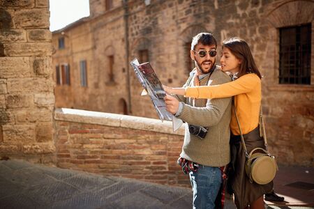 Young happy lovers couple visiting Italy as touristsの写真素材