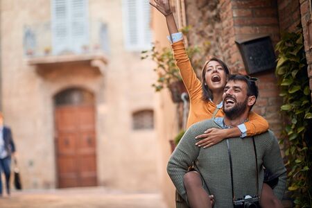 Happy man and woman travelling in European on vacation.の写真素材