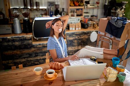 Happy Woman sitting in bar chewing gum