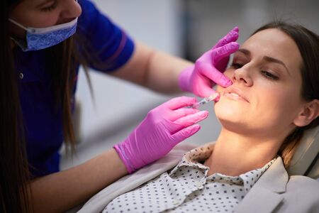 Middle aged woman having anti aging treatment in a beauty salon