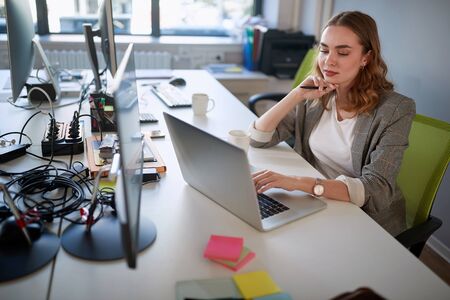 Expertise woman working at  business plans on  laptop.の写真素材